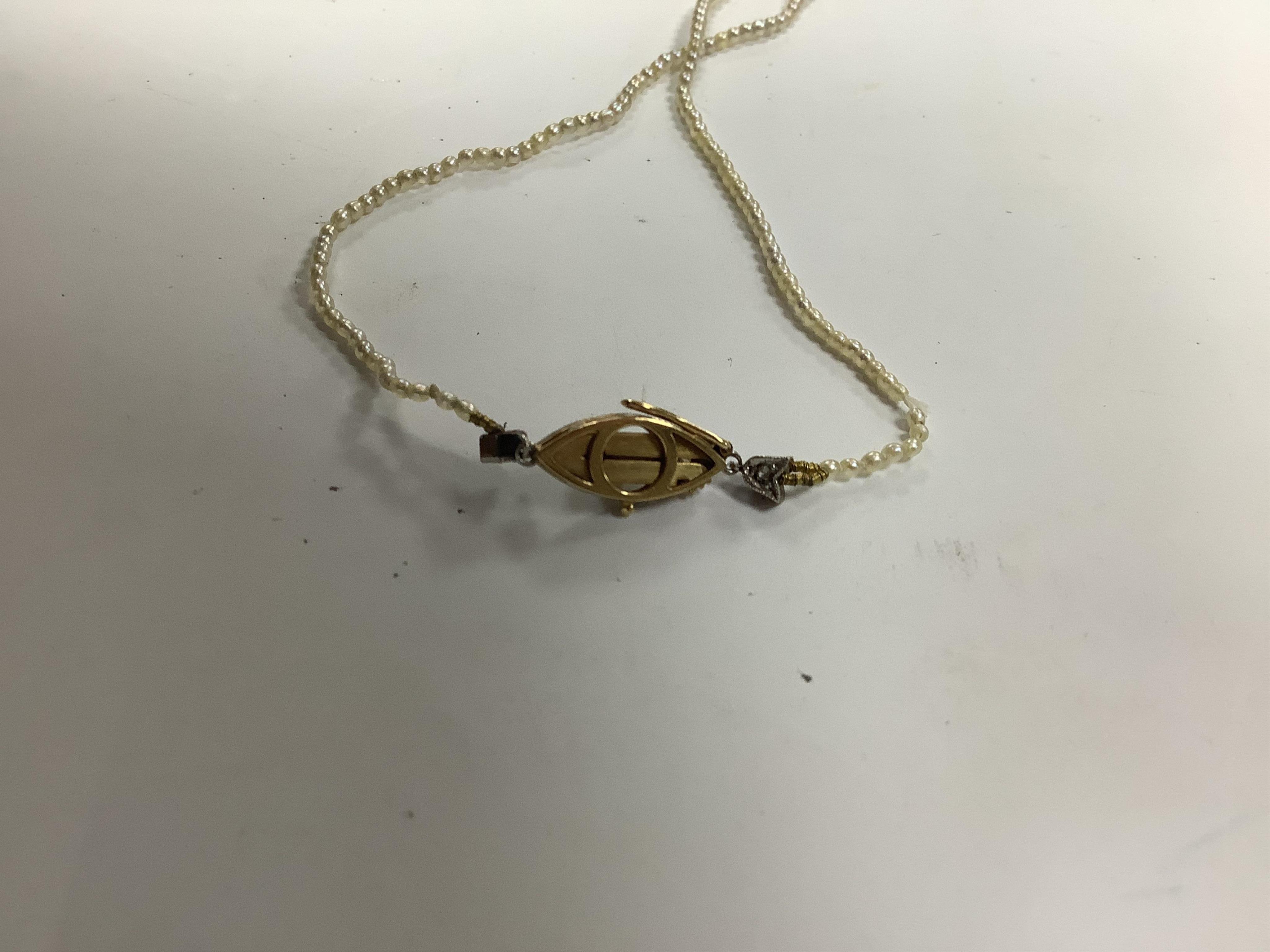 Assorted jewellery including two 9ct and gem set pendants, two 9ct and gem set pendants, an 18ct and gem set pendant, a pair of 9ct and gem set line ear studs, two 14k rings, an 18k and gem set ring and a seed pearl neck